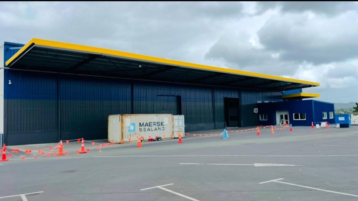 Rosebank industrial building repainted dark blue with yellow roofline detailing